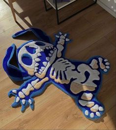 a blue and white rug with a skeleton on it