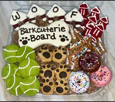 a plastic container filled with lots of different types of cookies and pastries on top of each other