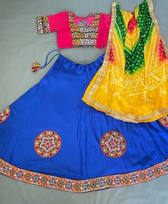 *🌷Lehenga choli🌷* *Lehenga(Stitched)* Lehenga Fabric : Cotton  Lehenga Work : Embroidered Aari Work Patches (Lace Border)  Lehenga Closer : Drawstring and tassels  Lehenga Waist : Support Up To 42  Length : 41 Flair : 4 Meter Inner : Micro Cotton *Blouse(Stitched)* Blouse Fabric : Cotton  Blouse Size:  38"( There Is a extra two inch Margin so Customer Can Adjust Upto 36 To 42) Blouse Work : Embroidered Aari Work Patches  Blouse length : 15" Sleeve Length : 20" *Dupatta* Dupatta Fabric : Leheriya Bandhej Dupatta work : Gota pati border with Tassels Dupatta Length : 2.3 Meter Actual colour may vary. While we do our best to capture colours accurately, colour might appear differently due to lighting conditions, the device on which the picture is viewed, etc. Please note that returns and exch Bohemian Lehenga With Pallu For Navratri, Anarkali Fitted Set With Multicolor Embroidery, Festive Semi-stitched Bandhani Print Choli, Fitted Choli With Multicolor Embroidery And Motifs, Fitted Multicolor Embroidered Sharara For Festivals, Fitted Saree With Multicolor Embroidery, Fitted Multicolor Embroidery Sharara For Festivals, Fitted Multicolor Embroidery Saree Set, Fitted Multicolor Embroidered Saree