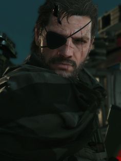 the metal gear character in metal gear is looking at his computer screen and wearing sunglasses