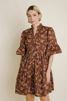 The Amelia Paisley Tiered Dress is the perfect choice for all your fall and holiday events. Whether you’re attending a fall wedding, hosting Thanksgiving dinner, or celebrating the season with friends, this dress has you covered. Made from soft poplin cotton with a gorgeous paisley print in a rich golden brown hue, it exudes autumn charm. The flattering tiered silhouette adds a touch of elegance, while the full button front and above-the-knee length create a versatile look that transitions easil Hosting Thanksgiving Dinner, Indie Dresses, Athleisure Shoes, Hosting Thanksgiving, Holiday Events, Fall Days, Button Front Dress, Cropped Denim Jacket, Down Dress