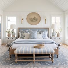 a large bed sitting in a bedroom on top of a blue and white carpeted floor