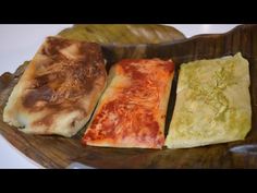 four different types of food on a wooden plate