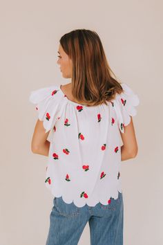 Get ready to fall in love with our Cherry Lover Top! This off-white shirt features delicate embroidered cherries, scalloped edges, and flutter sleeves for a playful touch. Made with sheer material and an elastic boat neckline, this top is both feminine and fun. (Cherry-picked perfection!) Details Off-white shirt with embroidered cherries Scalloped edges Flutter sleeves Sheer material Elastic boat neckline Sizing Approximate measurements: SIZE LENGTH BUST Small 23" 40" Medium 23.5" 42" Large 24" Embroidered Cherries, Nursing Friendly Tops, Nursing Friendly Dress, Plus Jumpsuit, Exclusive Dress, Sheer Material, Basic Dress, Maternity Shops, Scalloped Edges