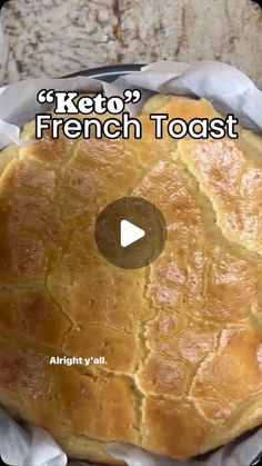 a pie sitting on top of a pan covered in wax paper with the words keto's french toast