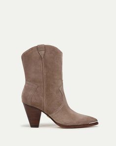 Veronica beard cody suede western bootie - taupe    a modern take on the classic western boot. cody takes the traditional details—pointed toe curved top-line pull tabs and angled stitching—and reimagines them with clean lines. wear over jeans or under fluid skirts.    - suede    - 3" heel  - store in a cool dry place inside dust bag  - clean under the supervision of a specialist    veronica swanson beard and veronica miele beard are the sisters-in-law and design duo behind namesake contemporary label veronica beard. launching with a signature jacket style the “dickey” single-button blazer the company found its niche in the contemporary market as the jacket’s popularity quickly caught on with celebrities and influencers. the veronicas understand feminine tailoring that remains timeless desi Bearded Lady, Ankle Heels, Western Booties, Single Button Blazer, A Perfect Circle, Veronica Beard, Blazer Buttons, Kids Sleepwear, Classic Outfits