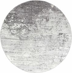 a round rug with grey and white colors