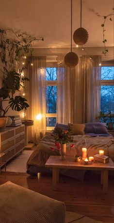 a living room filled with furniture and candles