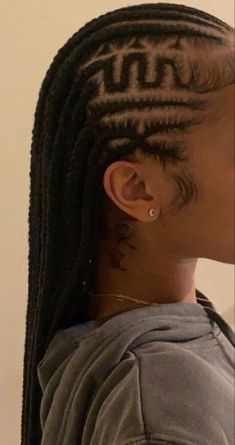 a woman with dreadlocks has her hair in a ponytail