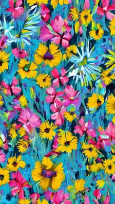 an image of colorful flowers in the grass