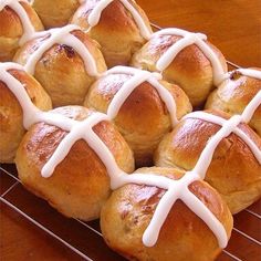 hot cross buns with icing on a cooling rack