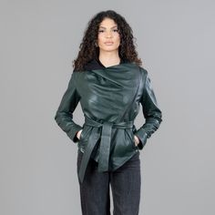 Green leather jacket with a belt and a hood. This jacket has exterior side pockets, a hood, a removable belt, and a side zipper closure. Furthermore, the green leather jacket with a belt will stand out with its pattern and warmth. The jacket manufactures in our company in Greece with high-quality leather. Leather: Yes Color: Green Length: 50-55 cm (19,6-21,6 in) Hood: Yes Exterior pockets: Yes Belt: Yes Lining: 100% Polyester Care: Specialist clean Leather Jacket With Belted Cuffs, Winter Green Belted Outerwear, Hooded Leather Outerwear For Work, Hooded Belted Fall Outerwear, Hooded Belted Outerwear For Fall, Belted Hooded Outerwear For Fall, Winter Leather Jacket With Belted Design, Green Outerwear With Belted Cuffs And Long Sleeves, Winter Workwear Outerwear With Storm Flap