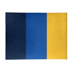 a blue and yellow rug on a white background