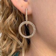 Brilliant cubic zirconia catches the light with every movement in this double loop statement earring. Elevate your jewelry collection with this versatile earrings that effortlessly transition from day to night. Double loop with Pave CZ Post Back Clip Elegant Cubic Zirconia Hoop Earrings With Bling, Elegant Round Hoop Earrings With Rhinestones, Glamorous Round Earrings With Sparkling Stones, Elegant Round Sparkling Hoop Earrings, Modern Jewelry With Sparkling Cubic Zirconia Stones, Elegant Rhinestone Hoop Crystal Earrings, Modern Cubic Zirconia Jewelry With Sparkling Stones, Chic Silver Diamond Earrings, Round Crystal Earrings For Evening