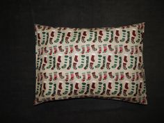 a pillow with christmas stockings on it