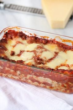 a casserole dish with meat and cheese in it