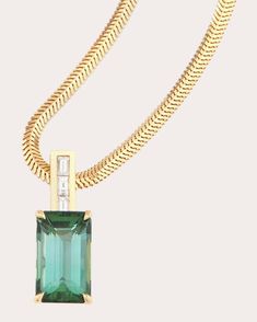 Anchored by a classic snake chain, this 18-karat gold necklace displays a green tourmaline pendant, a stone long believed to attract luck, success and prosperity. A trio of baguette-cut diamonds creates ambient shine. Lobster claw clasp 18k yellow gold, green tourmaline and diamond Carat: 0.19 ctw diamond, 4.13 ctw tourmaline Polish with soft cloth Made in Thailand Measurements Chain length: 18in Yi Collection, Attract Luck, Necklace Displays, Bar Pendant Necklace, Tourmaline Pendant, Diamond Bar, Baguette Cut Diamond, Bar Pendant, Diamond Carat