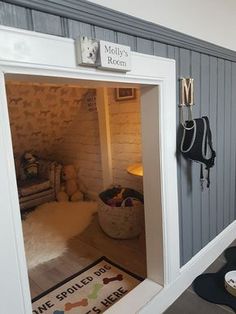 there is a dog house that has its door open to let the dogs in and out