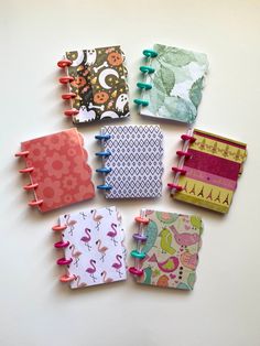 several small notebooks are lined up together