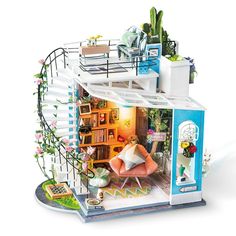 a doll house with furniture and flowers on the top floor is shown in this image