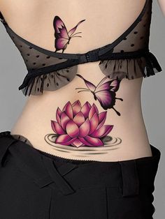 a woman's stomach with butterflies on it and a pink flower in the middle