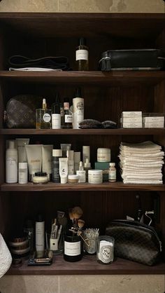 a bathroom shelf filled with lots of personal care items