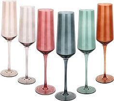 six different colored wine glasses lined up in a row