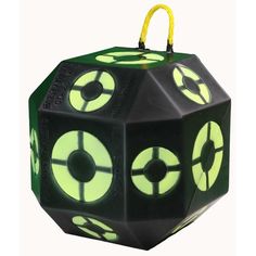 a black and green dice with yellow accents