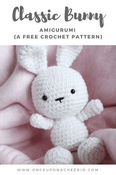 a crocheted white bunny sitting on top of a pink blanket with text overlay that reads, classic bunny amigurmi la free crochet pattern