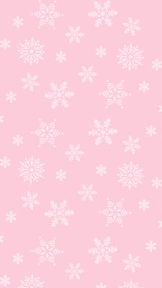 a pink background with white snowflakes on it