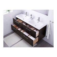 a bathroom vanity with two sinks and drawers