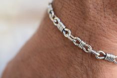 "Handmade sterling artisan silver chain link bracelet for men and for women. Two links in different size connected together with much smaller links. The larger link is 18 mm - 11/16\" of an inch The smaller link is 13 mm - 1/2\" of an inch The link connecting the other two is 8 mm The chain has been oxidized to achieved this rustic look and then polished to shine. The bracelet is made 8 1/2\" long - 21.5 and is closing with big lobster clasp. It is unusual and solid silver 10 grams If you like r Sterling Silver Chain Link Bracelet With Hooks, Sterling Silver Link Bracelet With Hook As Gift, Sterling Silver Oval Link Bracelet Gift, Silver Bracelet For Men, Jewelry For Man, Handmade Chain, Woven Chain, Silver Chain Style, Rustic Jewelry