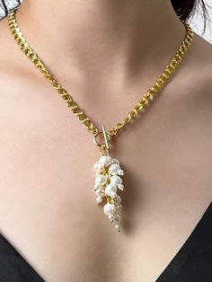 This exquisite necklace features a high-quality chain coated with 18-karat gold, gracefully draping around the neck and adding a touch of refined elegance. The necklace is 20 inches in length, allowing it to rest beautifully on the neck and décolletage. It is secured with a stylish toggle clasp, ensuring reliability and ease of wear. The centerpiece of this jewelry is a stunning cluster of pearls, reminiscent of luscious grape bunches. This unique design highlights the natural beauty of pearls, creating a distinctive look that suits any occasion--from formal events to everyday wear. Benefits of the Necklace: High-Quality Materials: The 18-karat gold-coated chain not only adds a luxurious appearance but also ensures the durability of the necklace. Unique Design: The pearl clusters provide o Pearl Lariat Necklace With Chain, Pearl White Lariat Necklace With Pearl Chain As Gift, Pearl Lariat Necklace With Clavicle Chain As Gift, Elegant Dangle Chain Necklace With Pearl Pendant, Elegant Dangle Pearl Pendant Chain Necklace, Elegant Chain Necklace With Pearl Pendant, Elegant Pendant Lariat Necklace With Lobster Clasp, Pearl Lariat Chain Jewelry, Lariat Necklace With Pearl Charm As Gift