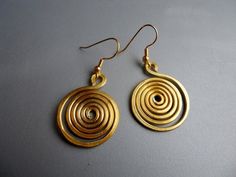 Round Spiral Snake Tribal Scroll Whimsical Hammered Gold Tone Aluminum Earrings v3 Adjustable Spiral Brass Earrings, Gold Spiral Earrings Made Of Copper, Hammered Brass Spiral Jewelry, Hand Forged Spiral Metal Earrings, Gold Wire Wrapped Earrings For Festival, Festival Spiral Gold Earrings, Spiral Snake, Aluminum Earrings, Alexandria Va