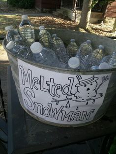 a metal bucket filled with lots of bottled water