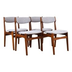 four danish teak dining chairs with grey upholstered cushions, mid - century