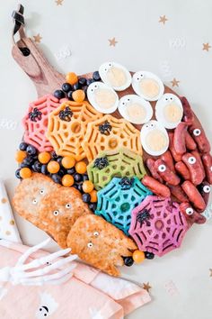 an assortment of halloween treats arranged in the shape of a brain