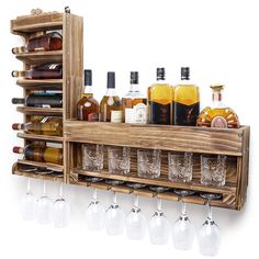 a wooden shelf with wine glasses and liquor bottles