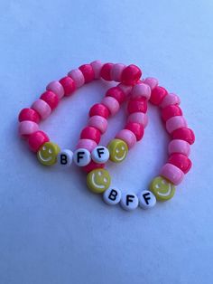 Interested in these BFF preppy beaded bracelet?  2 for 1 pricing- limited time.  These items would look great on your wrist and your best friend's.  All beads and color options can be modified.   Please message me for customization. Thanks for visiting my shop and thanks for your support. Personalized Novelty Beaded Bracelets For Friendship, Personalized Beaded Bracelets For Friendship, Pink Round Bead Bracelets For Best Friend, Pink Bracelets With Round Beads For Best Friend, Pink Round Beaded Bracelets For Best Friend Gift, Playful Name Bracelet With Round Beads For Friendship, Customizable Pink Fun Bracelets, Customizable Fun Beaded Bracelets For Friendship, Novelty Customizable Beaded Bracelets For Friendship