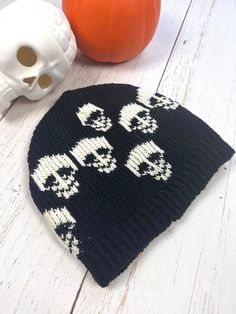 Black Skull Mens Beanie Cap Hand knitted Wool Cap with Skull  Unisex design, handmade  Perfect beanie for this Winter. Made with 100%  New Zealand  wool, lined with soft fleece.  Unique gift for your loved ones who are into gothic style.  Warm cap to wear every day or for hiking, running, skiing, or any outdoor activities.  Hand wash separately in cold water, flat dry. Stretches to fit into comfortable size. Approximate measurements:  Height-9" Width-10"  Black and Ivory color combination with s Black Knitted Hat For Halloween, Casual Knitted Halloween Hat, Black Halloween Beanie Hat, Halloween One Size Beanie Cap, Alternative Winter Cap Hat, Halloween Beanie One Size Fits Most, Alternative Winter Cap, Black Novelty Beanie, Black Novelty Beanie For Winter