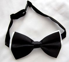 Dapper White Adjustable Bow Tie, Dapper Adjustable White Bow Tie, White Bow Tie For Black-tie Events, White Bow Tie For Black Tie Events, White Adjustable Bow Tie For Black Tie Occasions, White Dapper Bow Tie For Formal Occasions, Adjustable White Bow For Black Tie Occasion, White Adjustable Bow Tie Suit Accessories, Classic White Bow For Black Tie Occasions