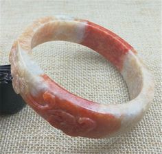 62.5mm Orange Tawny and Cream Hand-carved Lotus Jadeite Jade Bangle #Y67 Square Cut Small Green Dot - Icecream Dreamy! by BonAmiJADE on Etsy Brown Flowers, Jade Bangle, Green Dot, Square Cut, Self Healing, Healing Stone, Healing Stones, Natural Light, Lotus