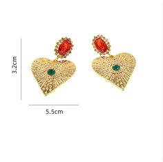 The sparkling crystals and exaggerated heart shape make a bold statement. Perfect for a night out or a special occasion. - Color: Gold- Material: Alloy, Rhinestones- Style: Earrings- Closure Type: Stud- Gender: Women Crystal Heart Earrings, Sparkling Crystal, Style Earrings, Crystal Heart, Heart Earrings, Gold Material, Heart Shape, Pre Order, Gold Earrings