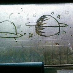 an image of the outside of a window with writing on it