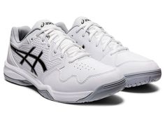 a white tennis shoe with black accents on the upper and side part of the shoe