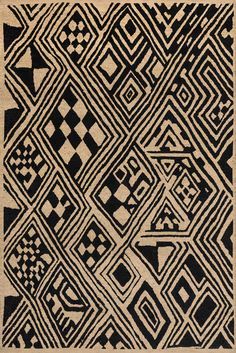 a black and white rug with an abstract design