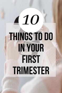 a woman looking at her phone with the text 10 things to do in your first trimester