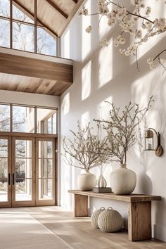 a living room filled with furniture and lots of windows