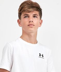 a young man wearing a white t - shirt with black logo on the left chest