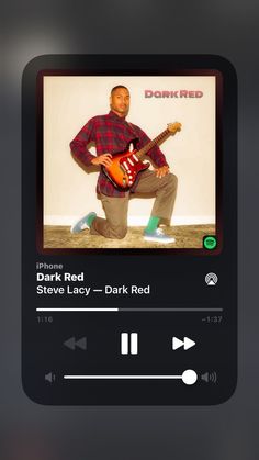 an image of a man playing guitar on the app store's music player screen